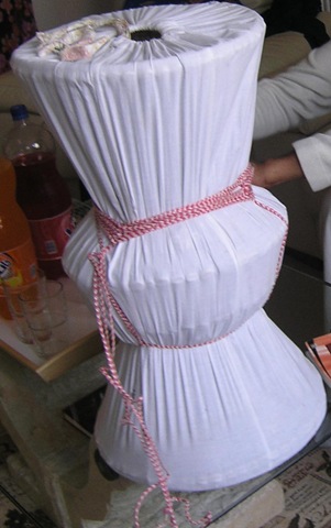  in her wedding gown and then process with the untying of the ropes